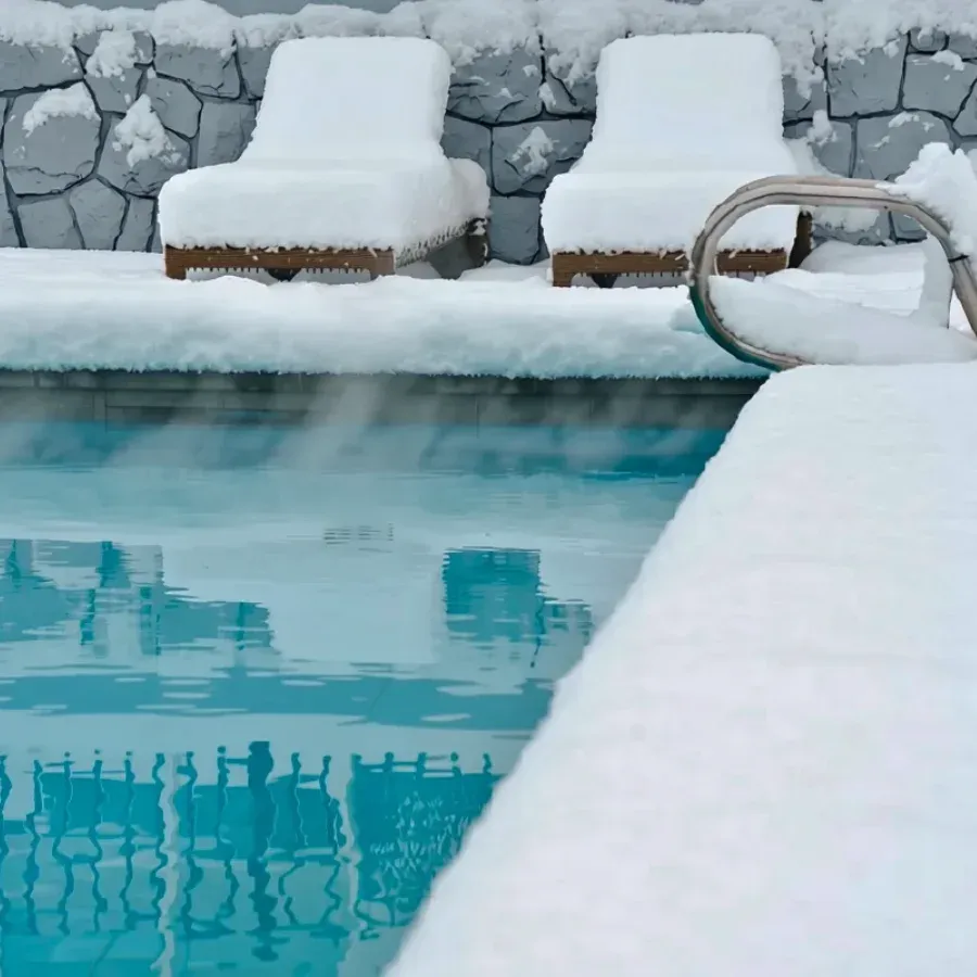 A pool with ice on the water